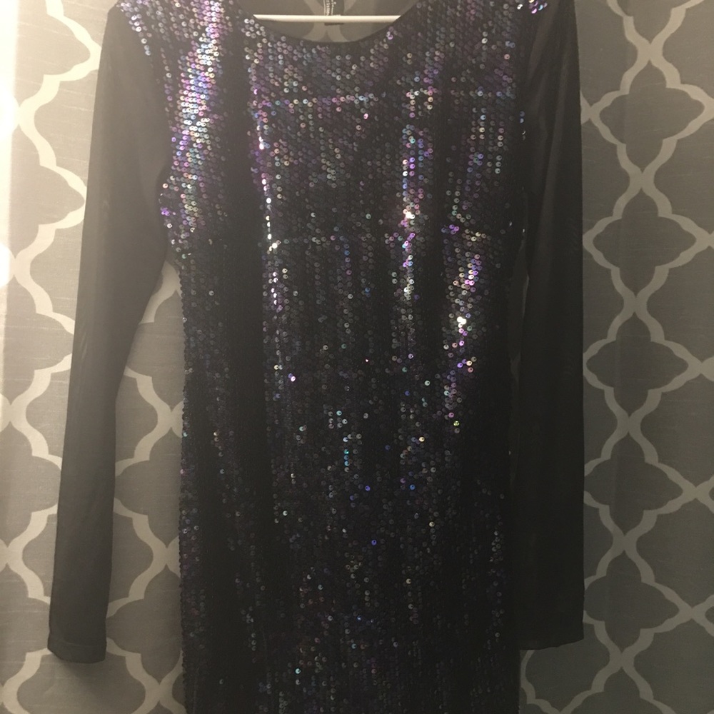 Above the knee dress with mesh sleeves and back.